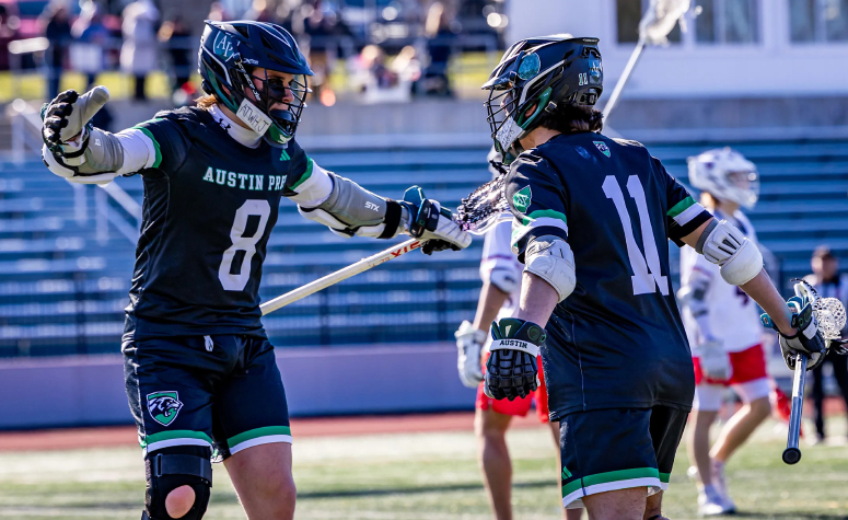 Duncan Vittands (left) and Logan McGovern celebrate during Austin Prep boys varsity lacrosse action.