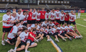 Lawrenceville's players celebrated their title after beating Brunswick. (Dan Arestia/NELJ)